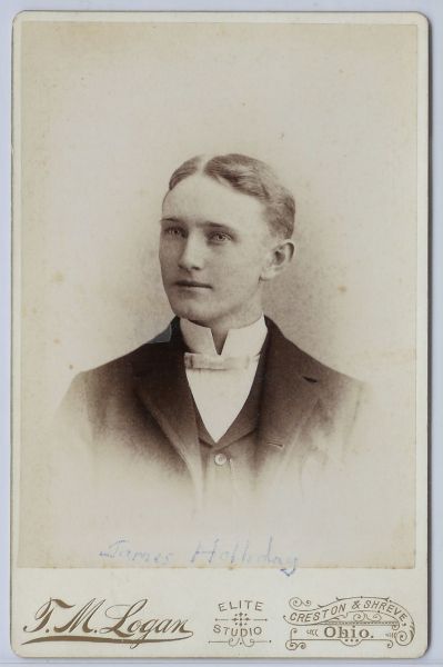 1889 TM Logan Holliday